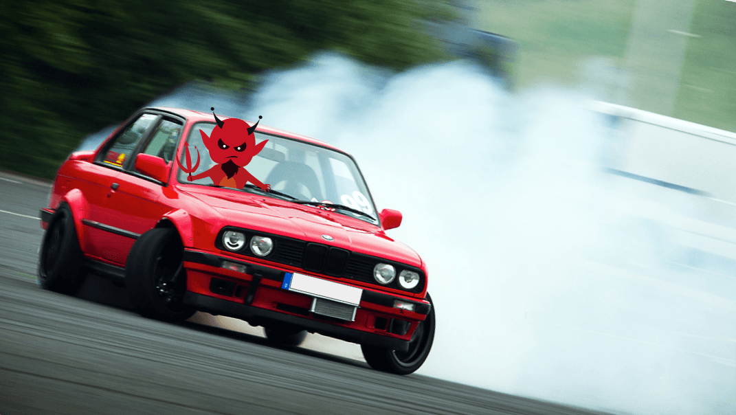 A red creature with horns in a car