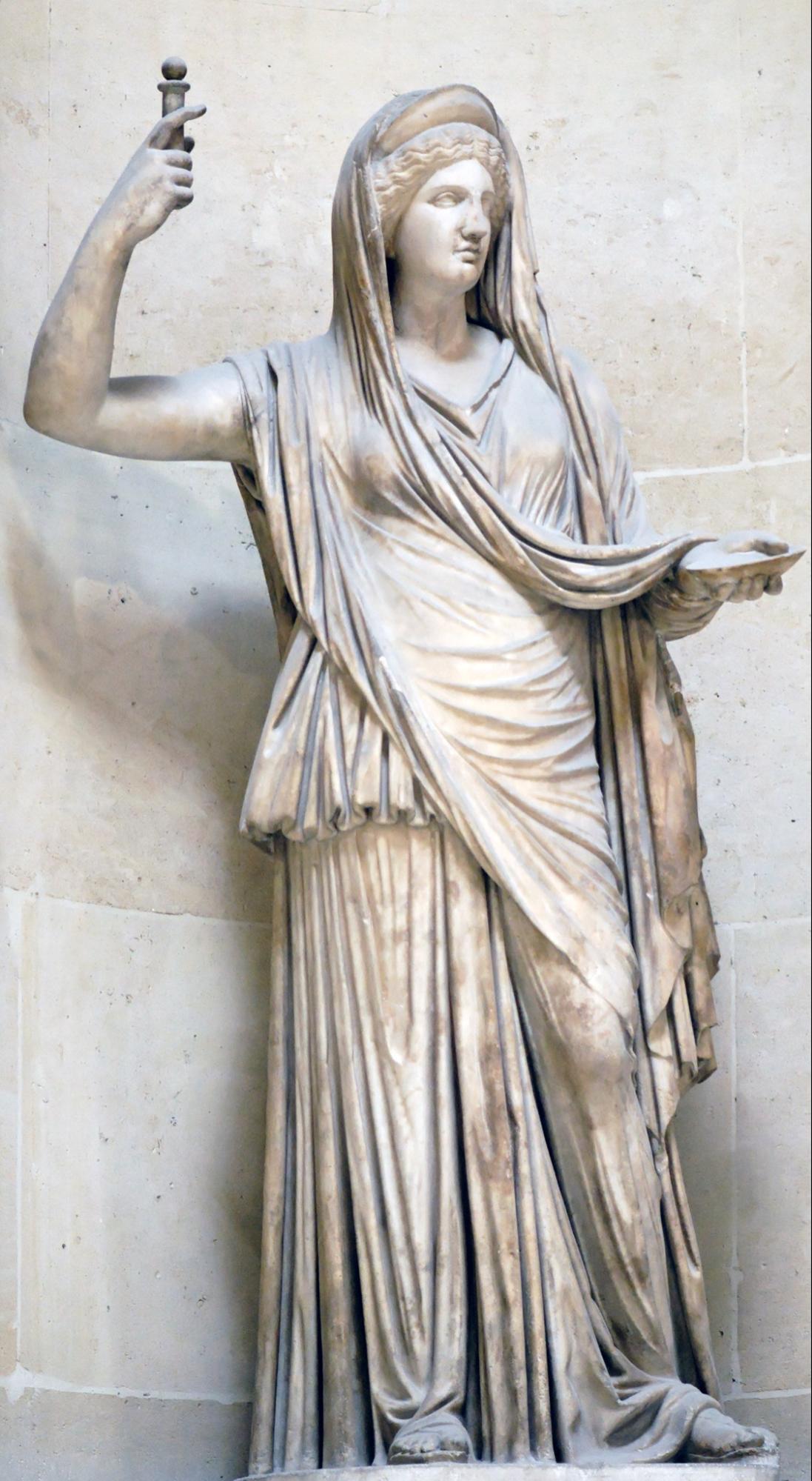 A marble statue of someone wearing a toga.