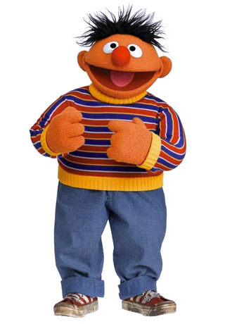 An orange character wearing a striped shirt and blue jeans.